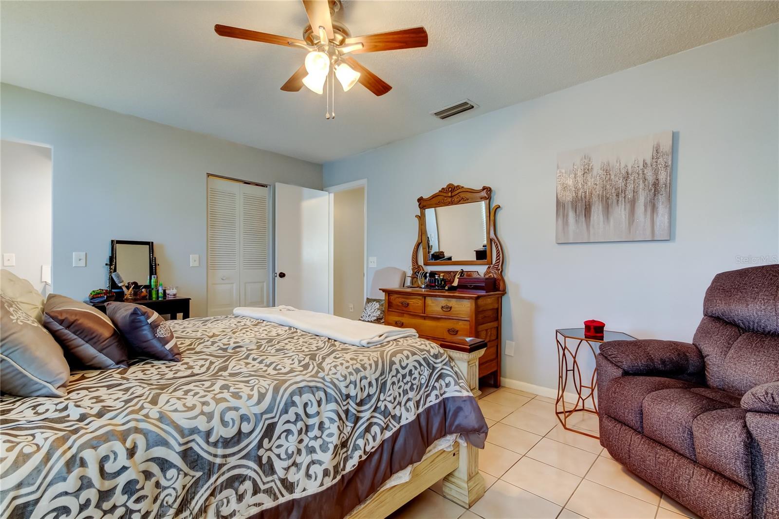 51.  Primary Bedroom (16.8' x 13') Features a Walk in Closet & Full Updated Ensuite Bathroom!