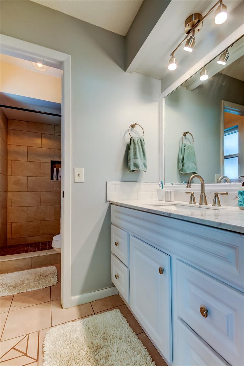 52. Primary Bathroom Offers 2 Spaces (5.8' x 4.1') for Oversized Vanity & Wet Room w Toilet & Shower (5.5' x 4.9') Works Nicely w Couples Trying to Get Ready at the Same Time!