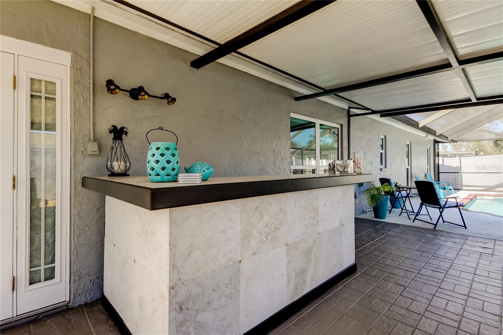 65. Covered & Screened Lanai (24.6' x 14.3') is HUGE .. Featuring a Built In Bar - Just BYOB!