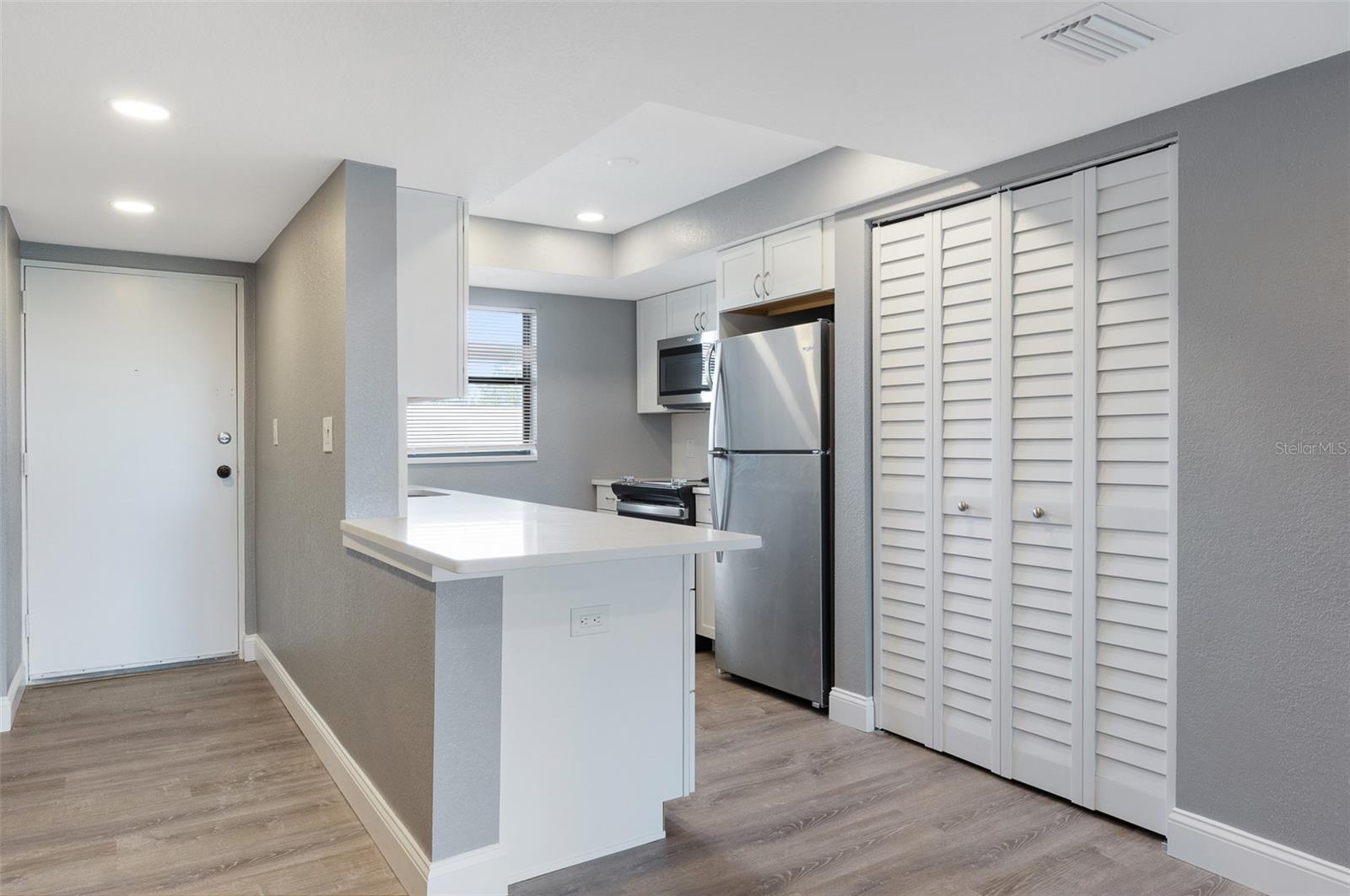 Laundry closet located next to the kitchen