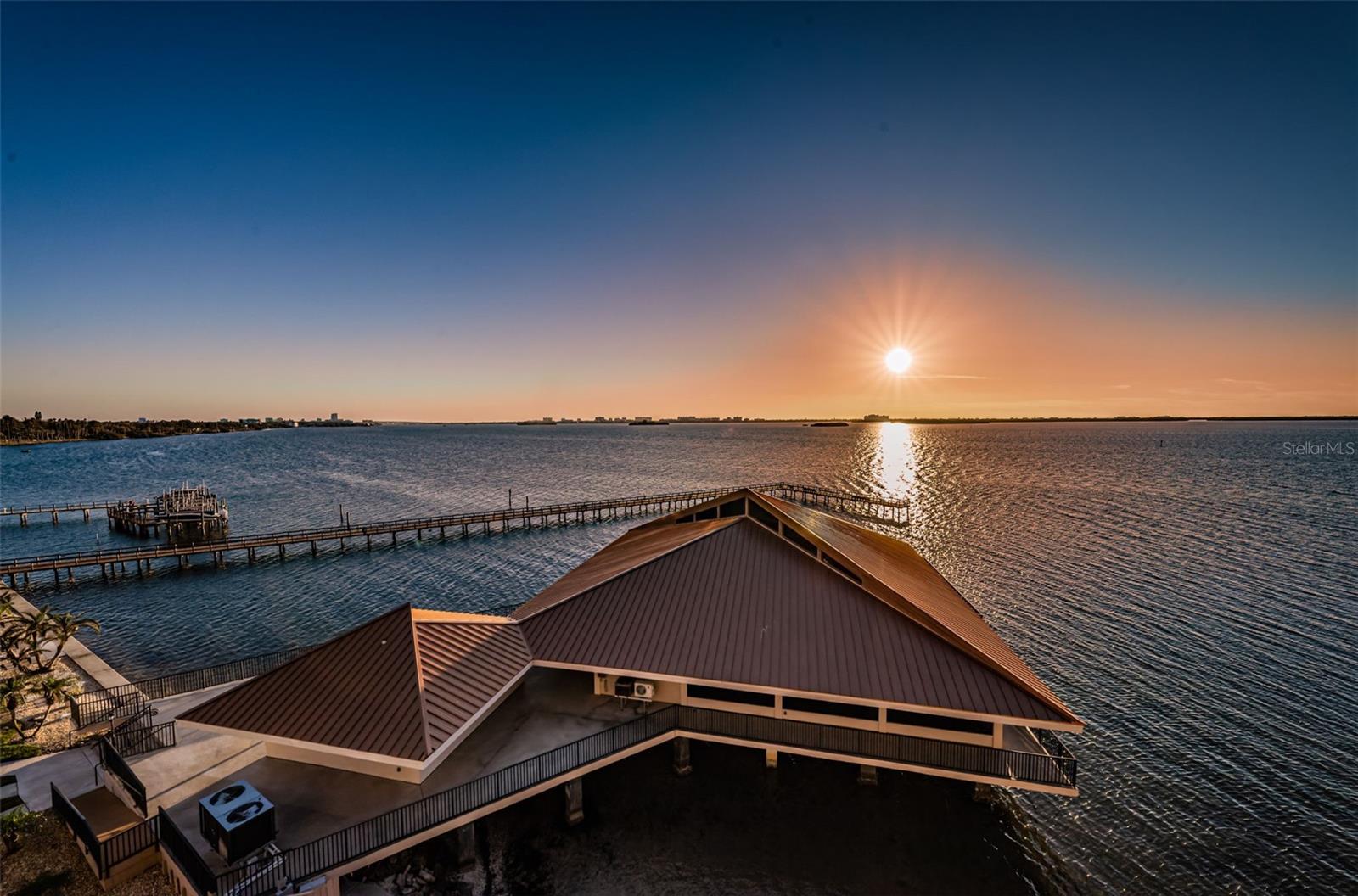 Clubhouse & Water View with Sunset