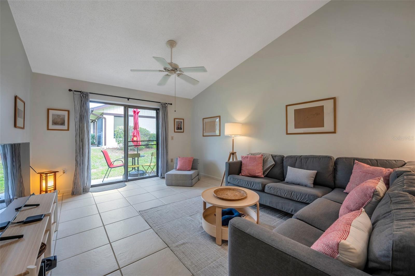 thte living room features tile floors