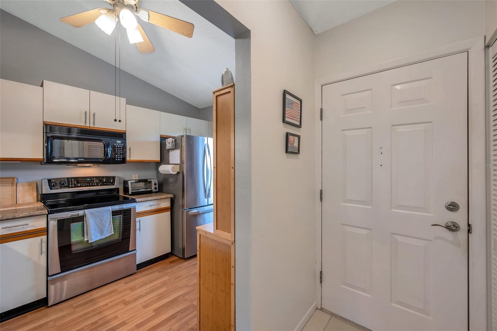 The Kitchen features stainless steel appliances and a vaulted ceiling