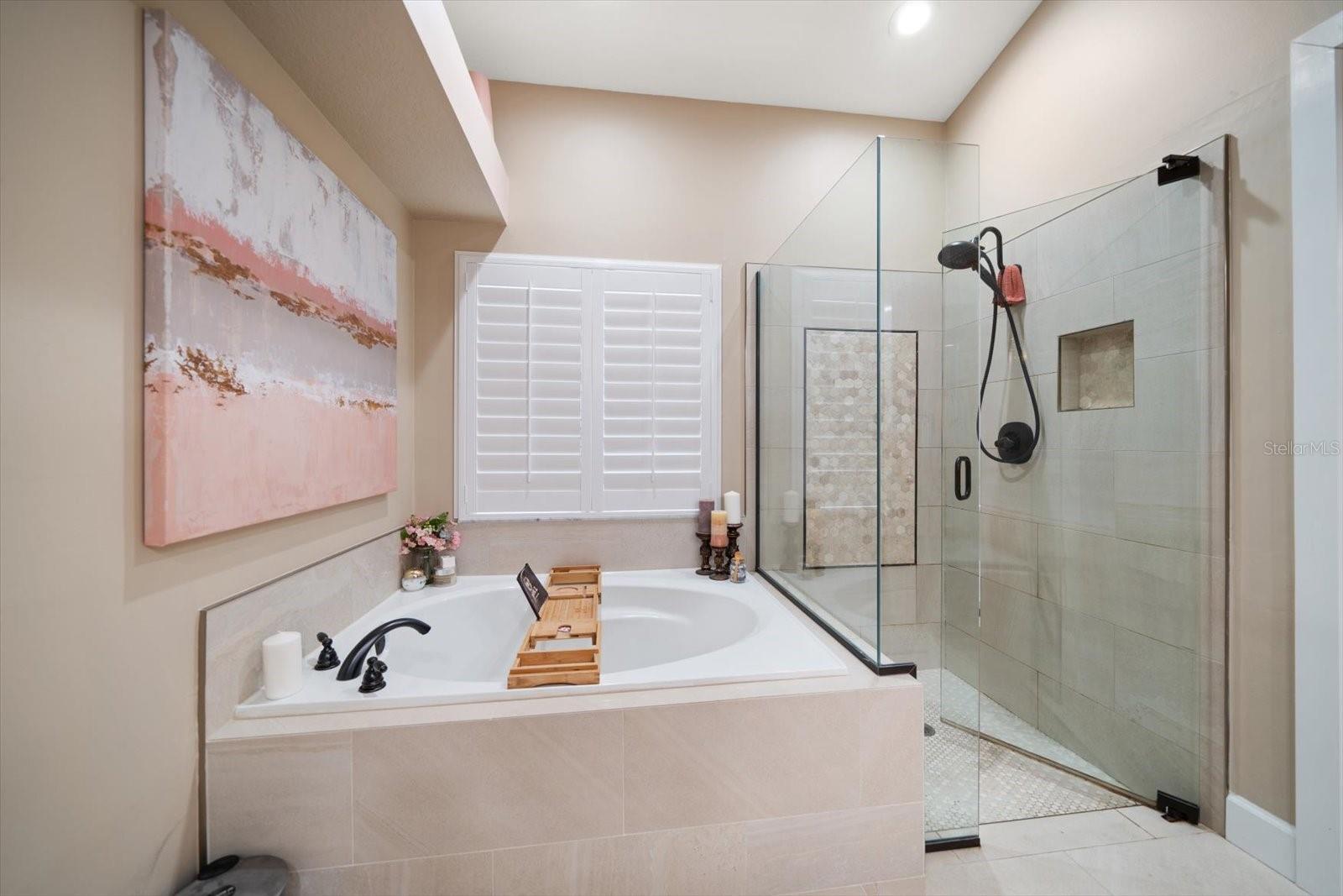 Soaking tub and glass enclosed walk-in shower