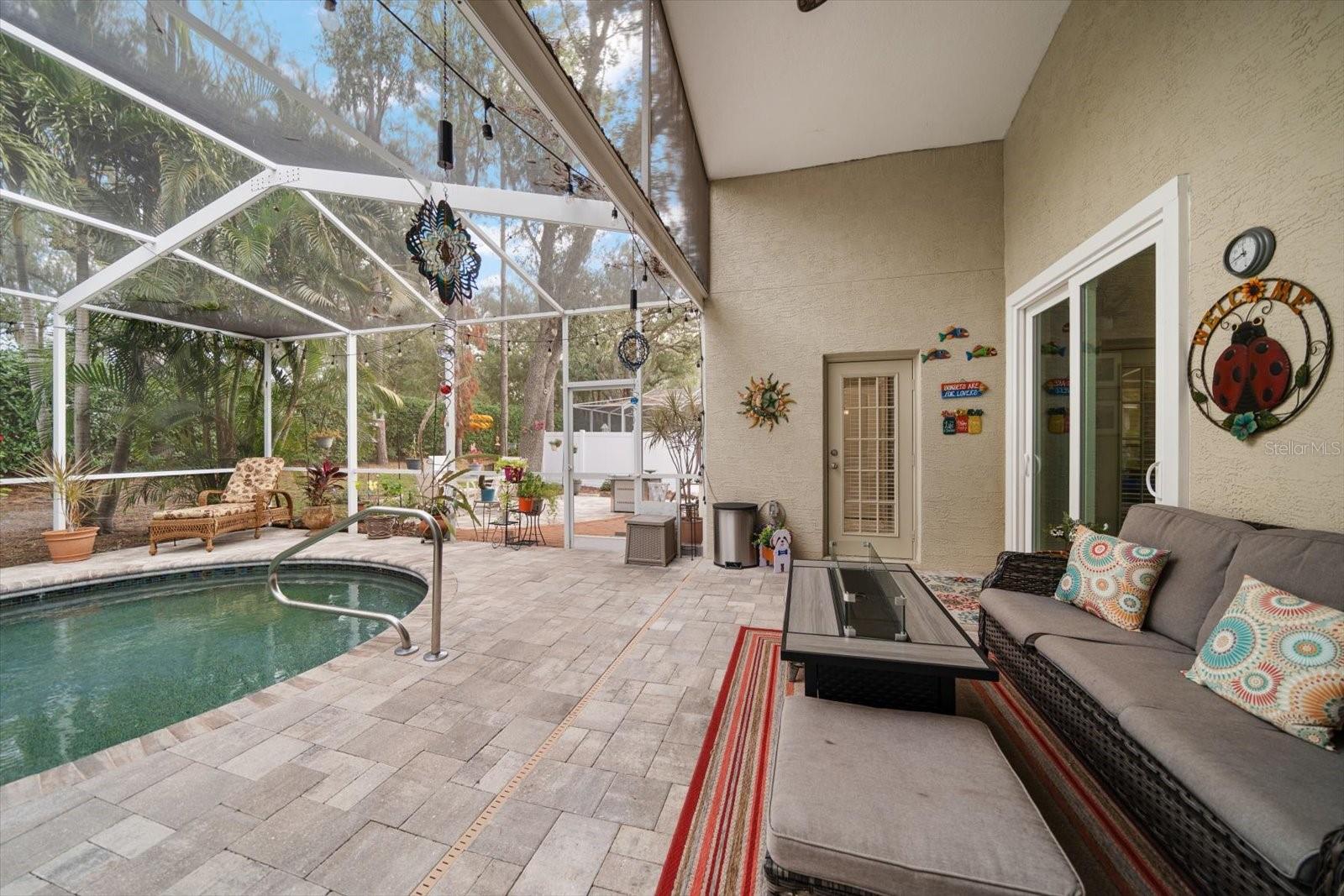 Screen enclosed pool and paver surround