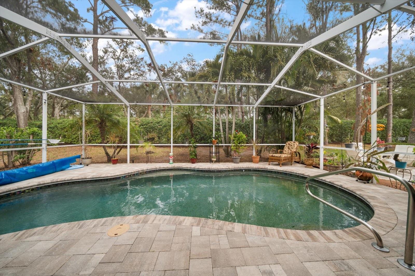 In-ground pool with pebble tech finish