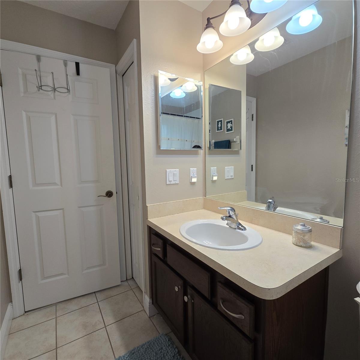 2nd full bathroom upstairs boasting a linen closet