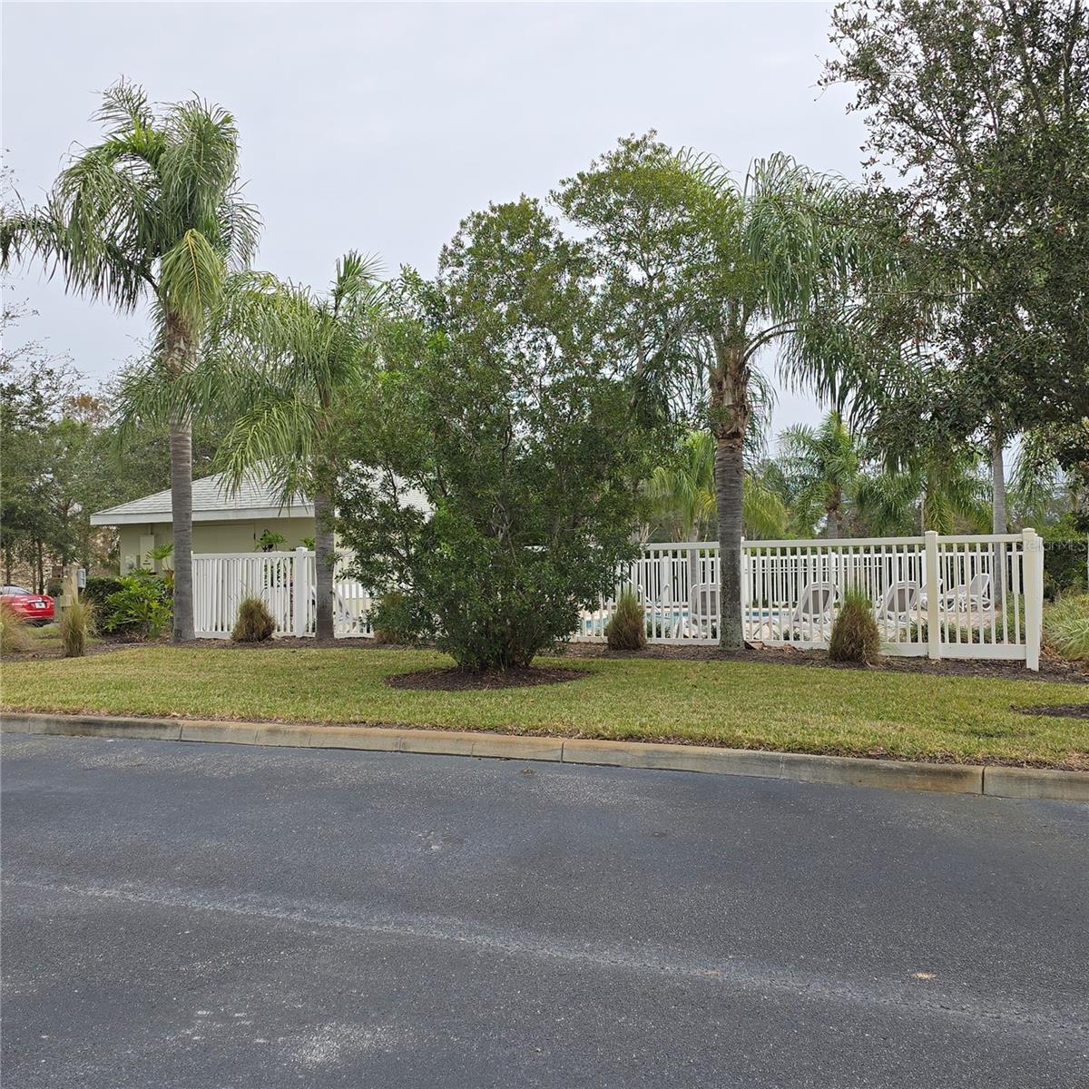 View of pool from driveway