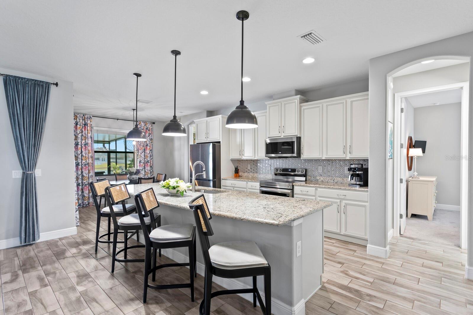 You'll find a spacious breakfast bar at the kitchen island