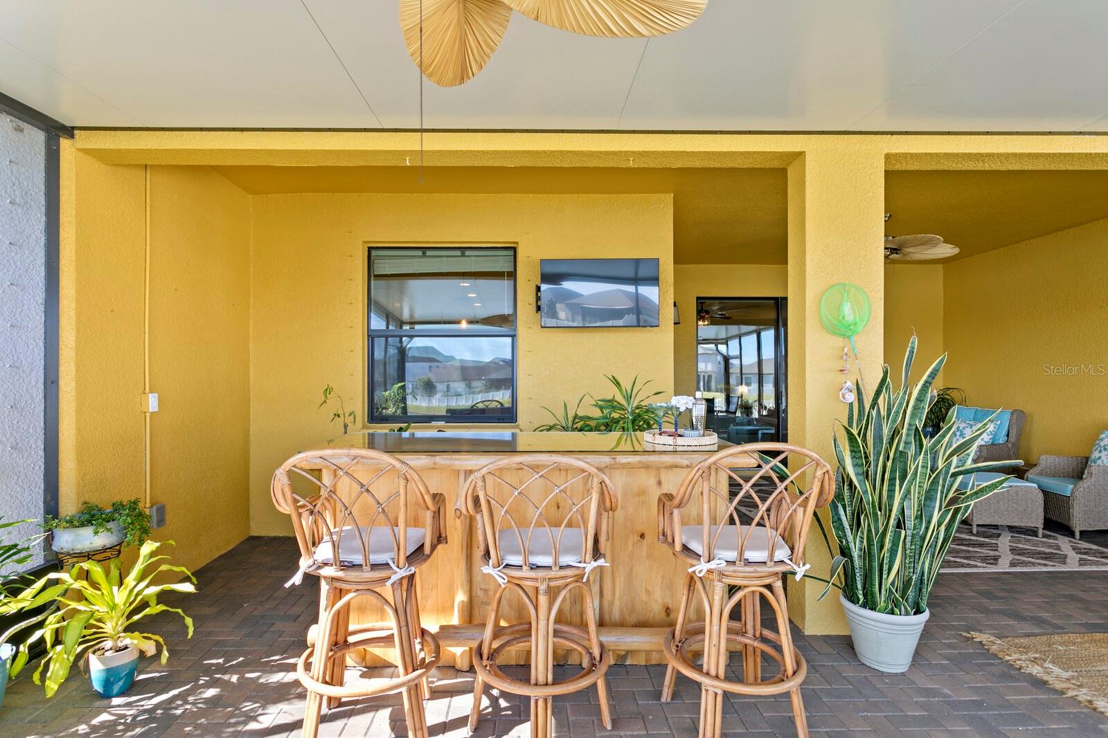 Watch the game at the bar on your outdoor lanai