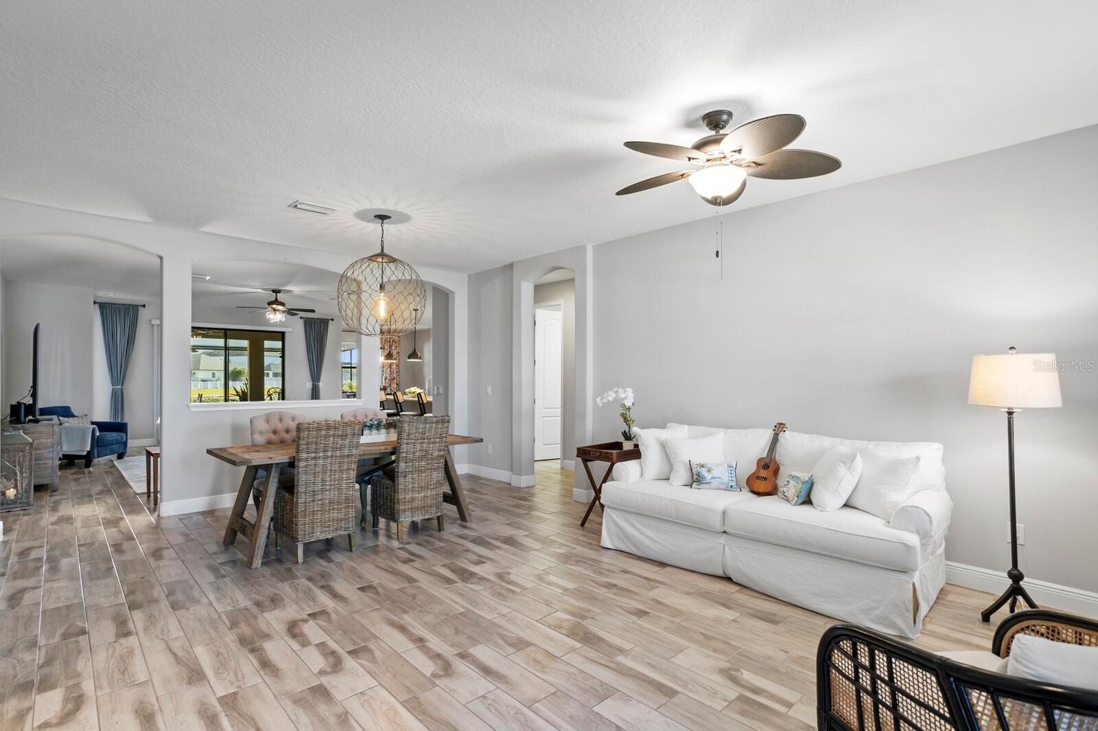 The living room extends into the formal dining room