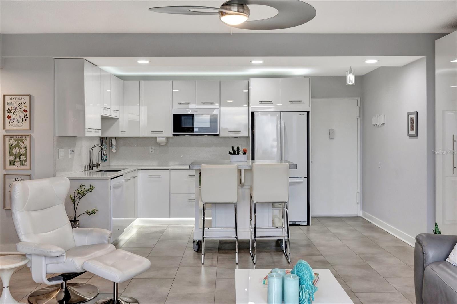 Living room looking into the bright kitchen area with Island