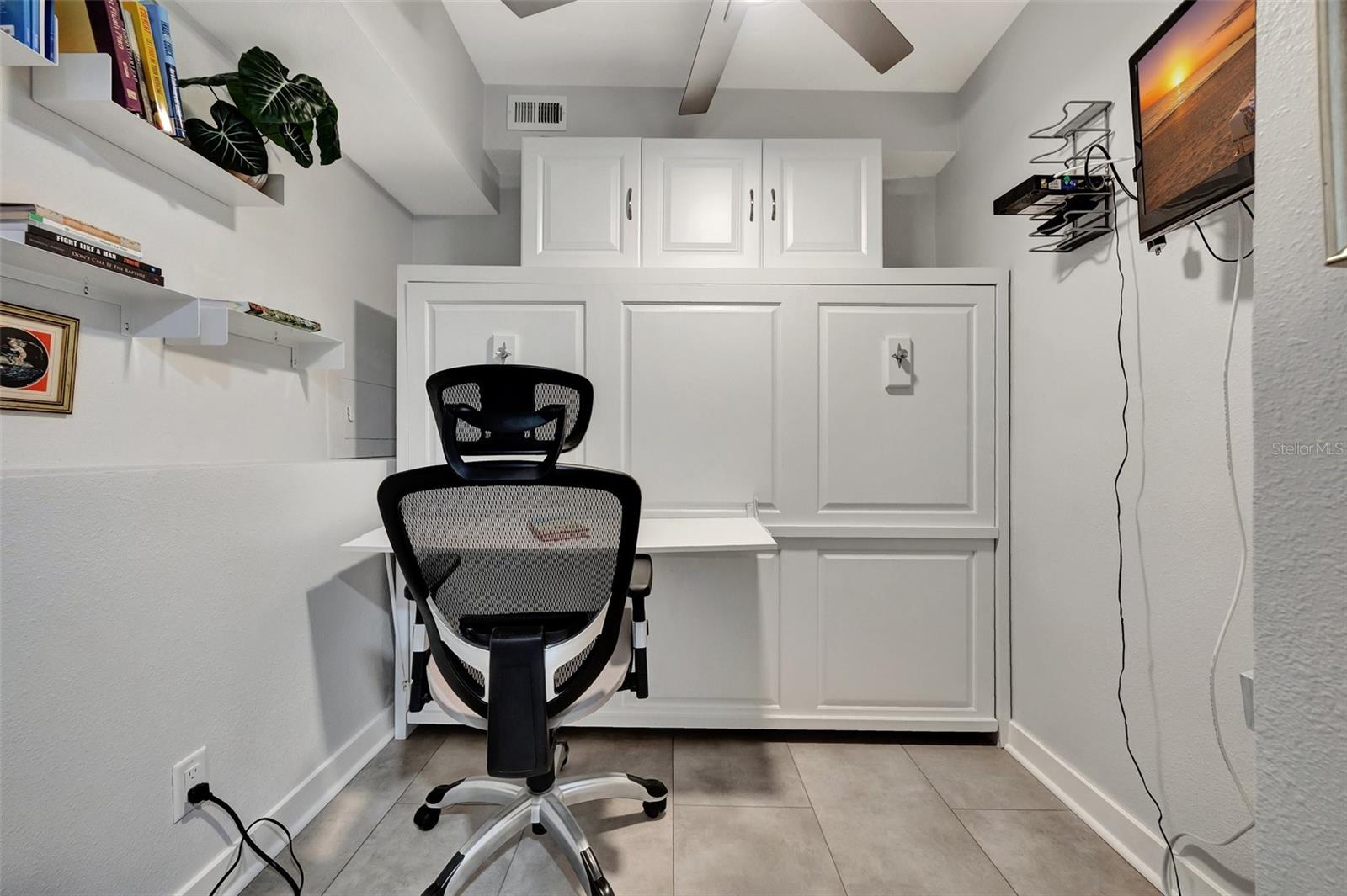 The Den has a built in desktop for you to work from home. which then converts to a murphy bed.