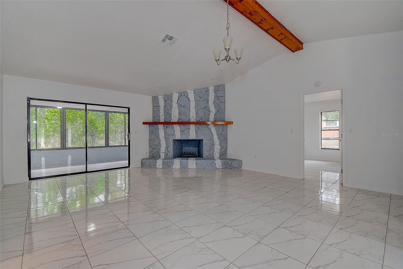 Great room with Vaulted ceiling & Woodburing Fireplace