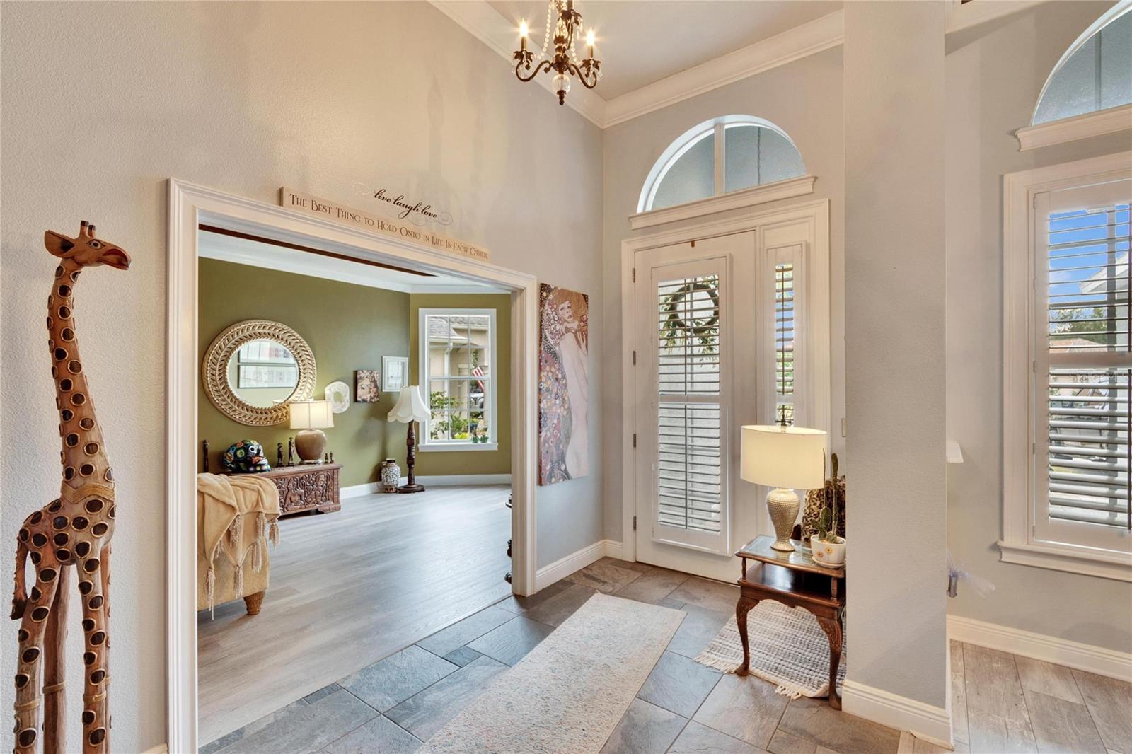 FOYER WITH SLATE TILE AND PLANTATION SHUTTERS