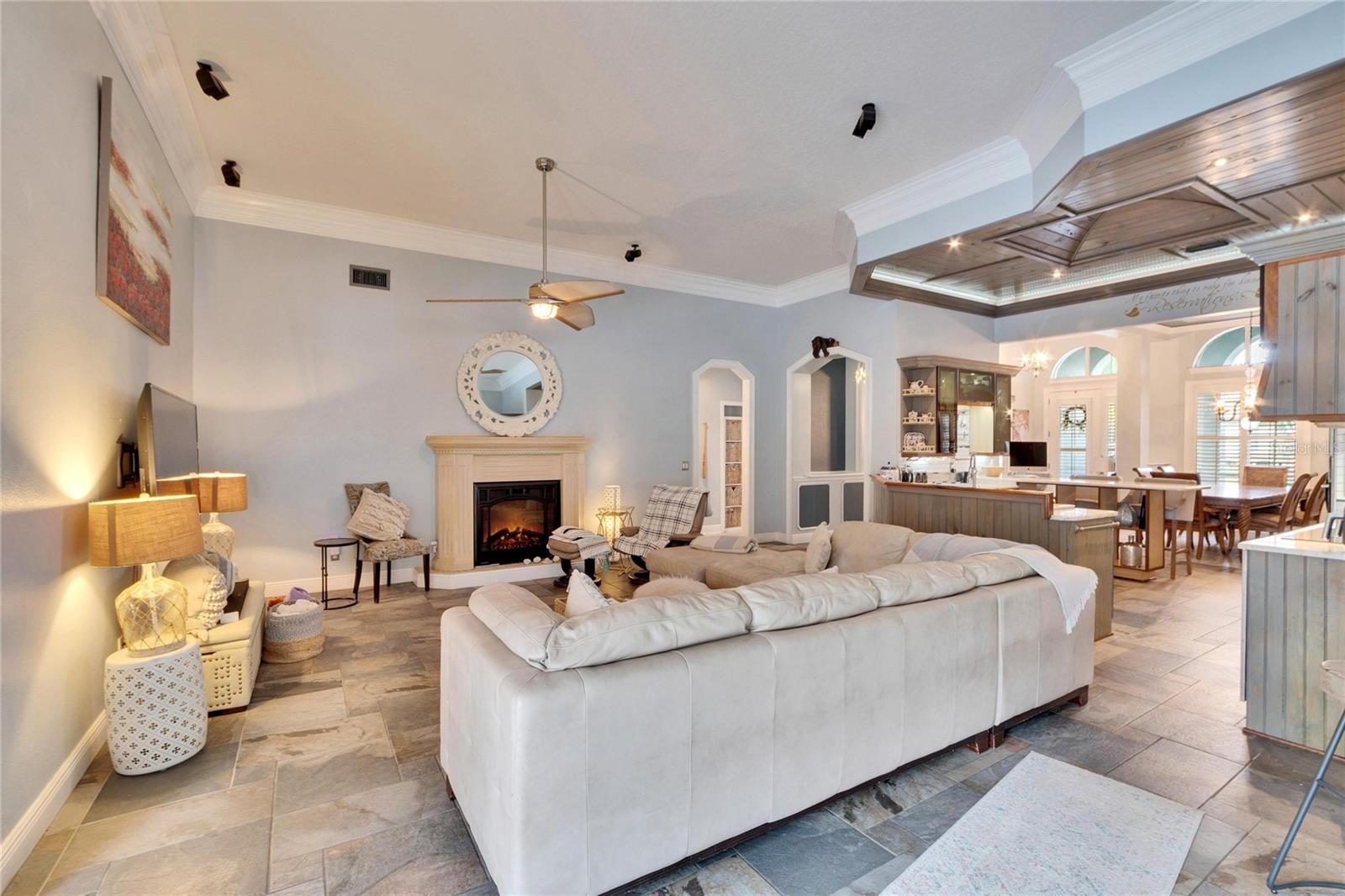 FAMILY ROOM WITH ELECTRIC FIREPLACE, CROWN MOLDING AND UPGRADED BASEBOARDS