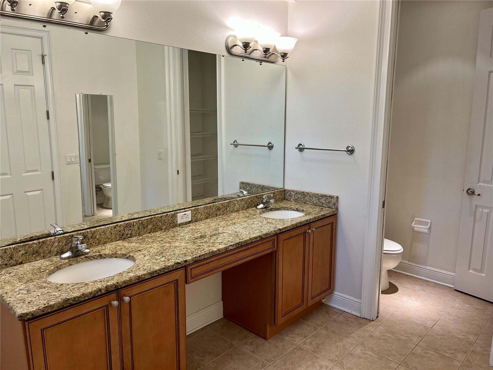 Huge primary bathroom with double sinks.