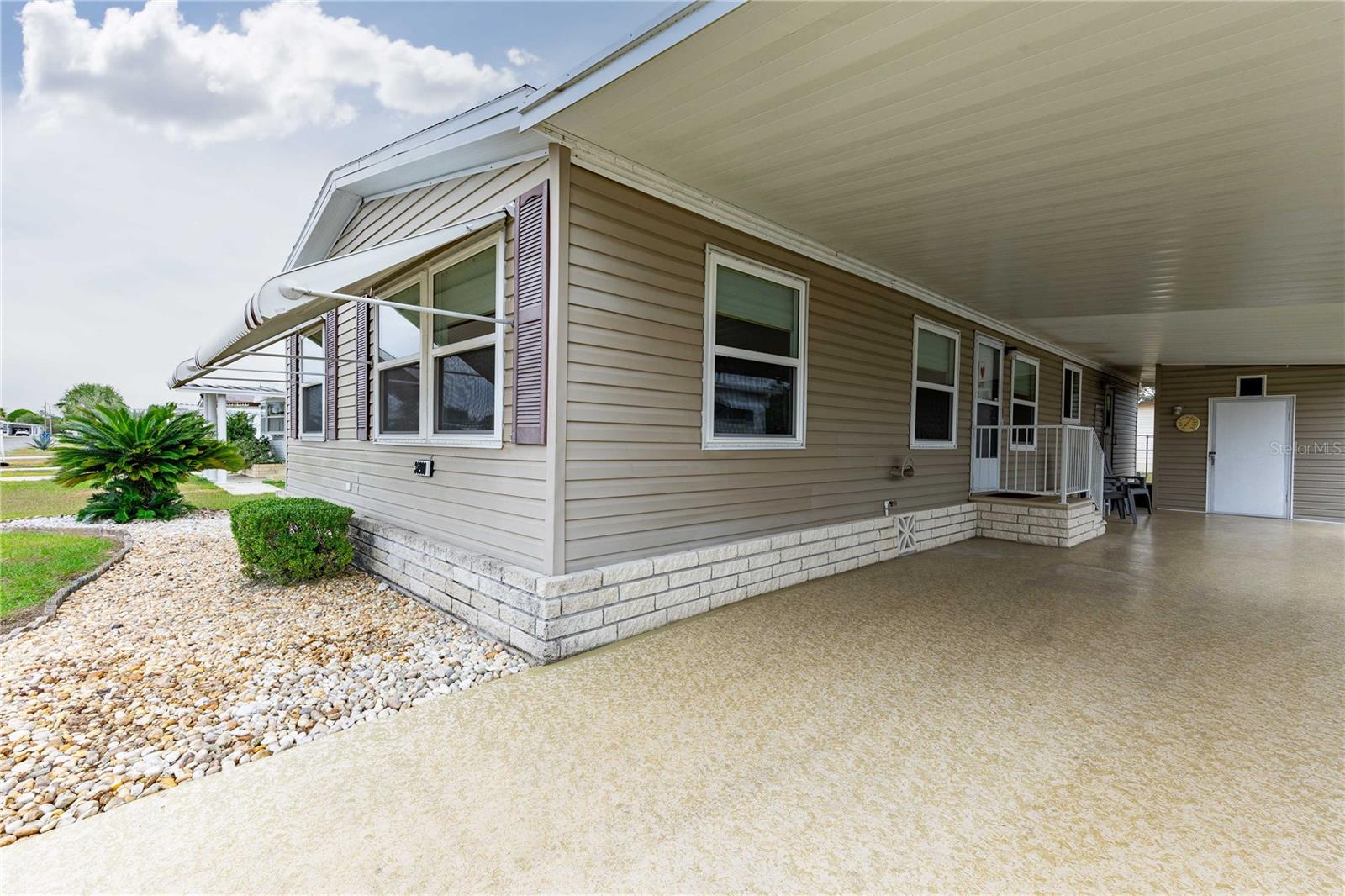 Painted driveway, double pane windows, and updated roof.