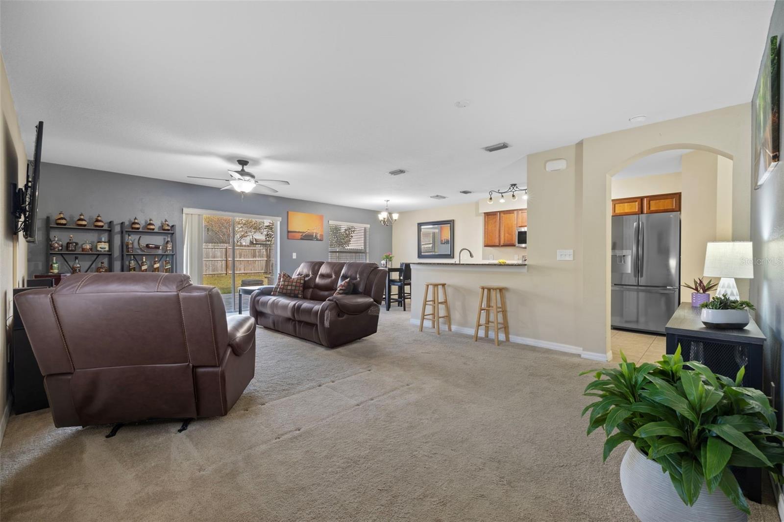 Open floor plan family room, dining room and kitchen