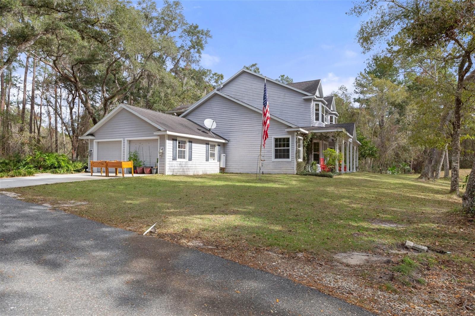 West side of home with 2 car garage.