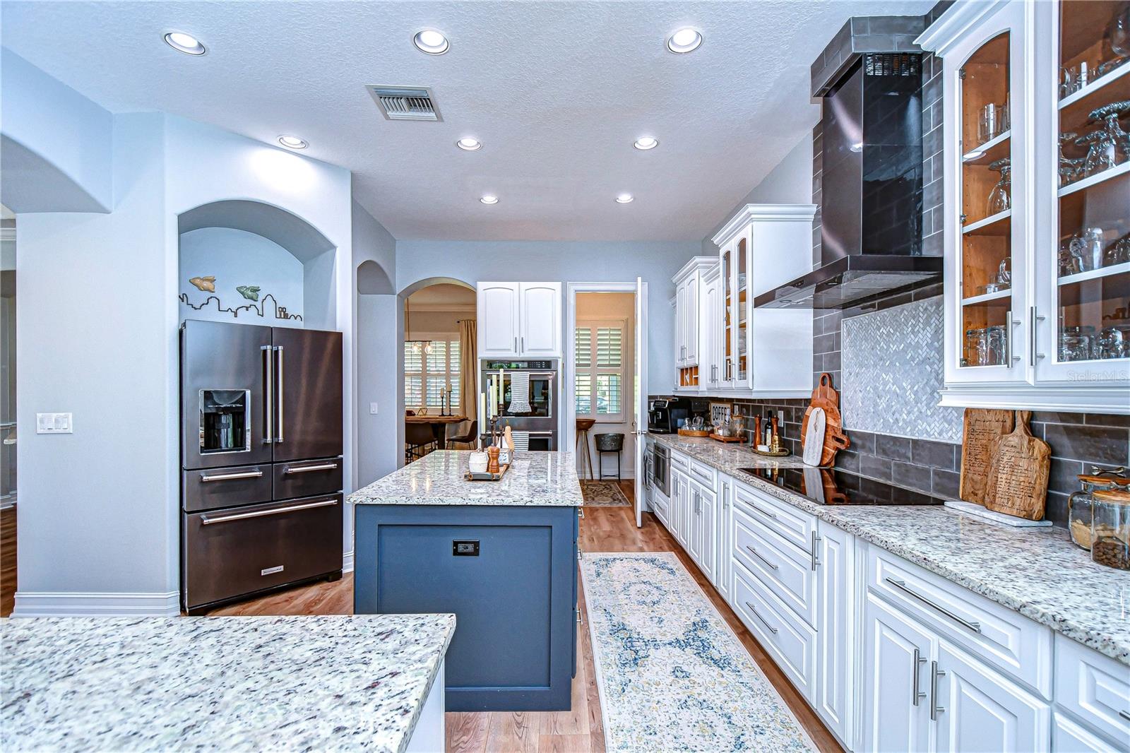 Stunning granite counter tops with ample cabinet space.