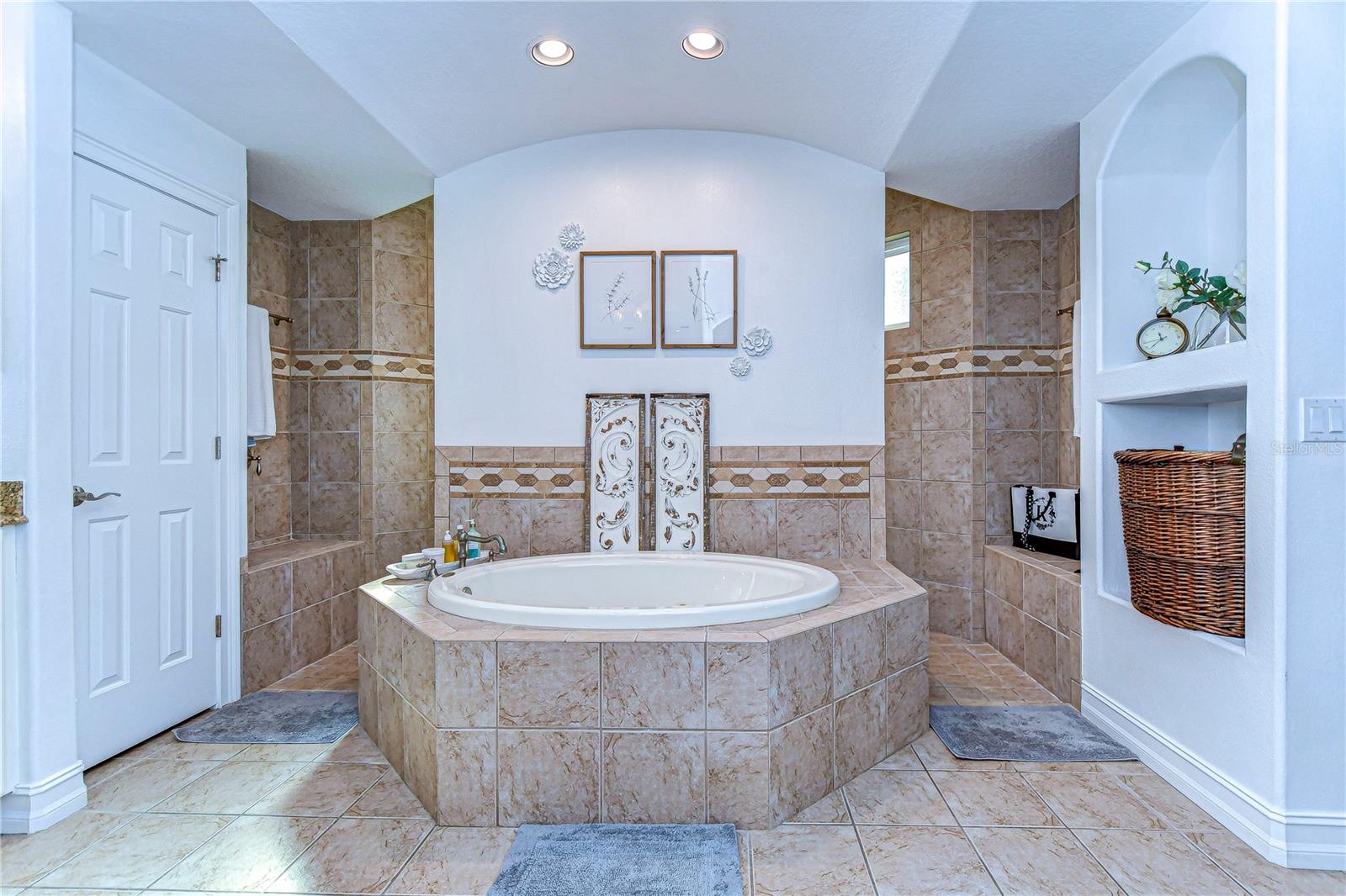 Primary suite with incredibly large walk in shower and soaking tub.