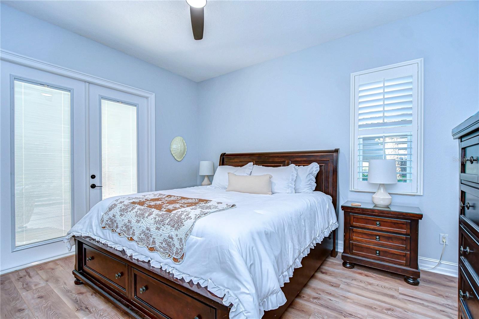 Second bedroom with gorgeous french doors leading to the pool.