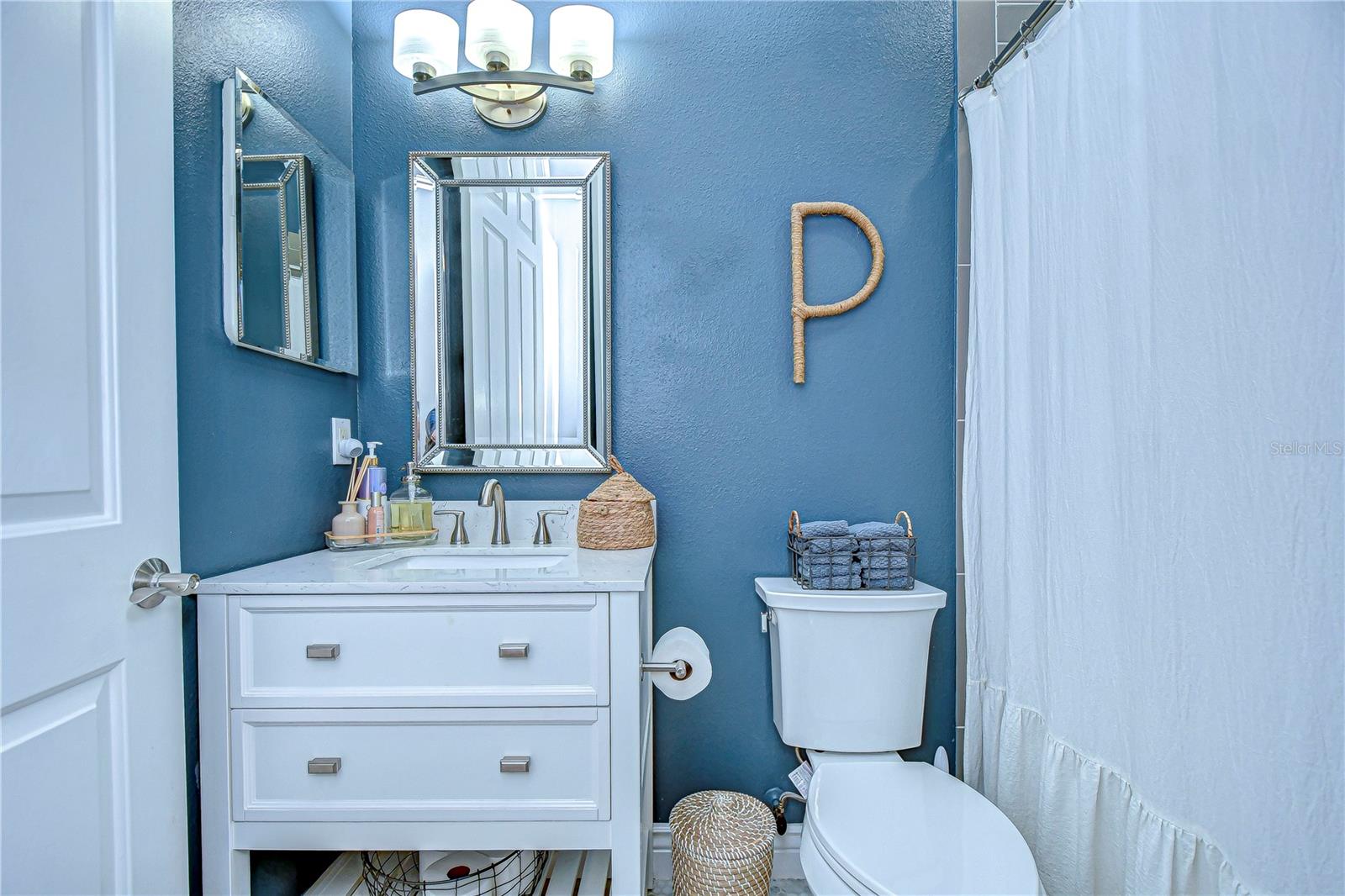 Second bathroom with updated sink/vanity.