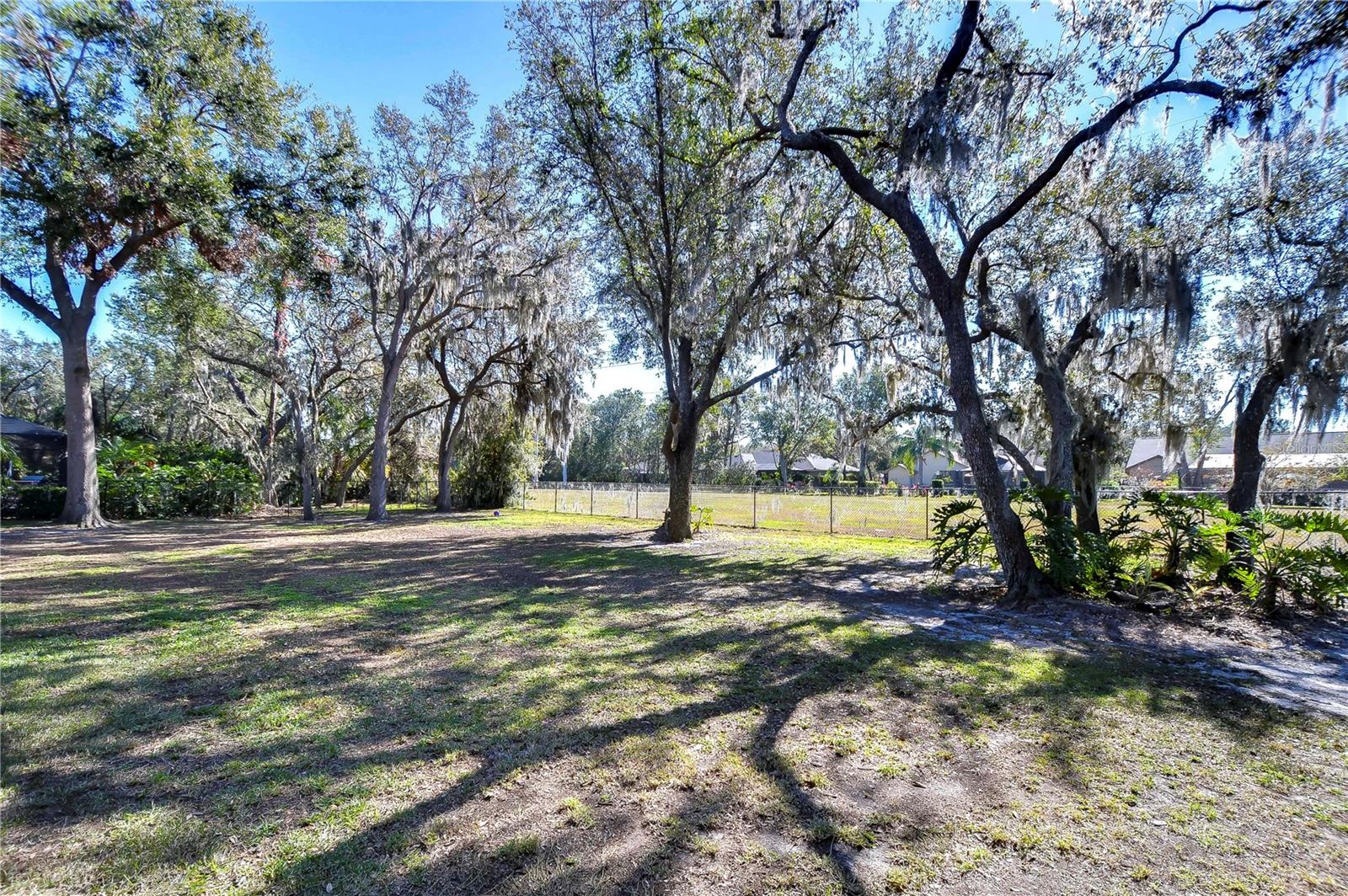 Landscape features mature trees.