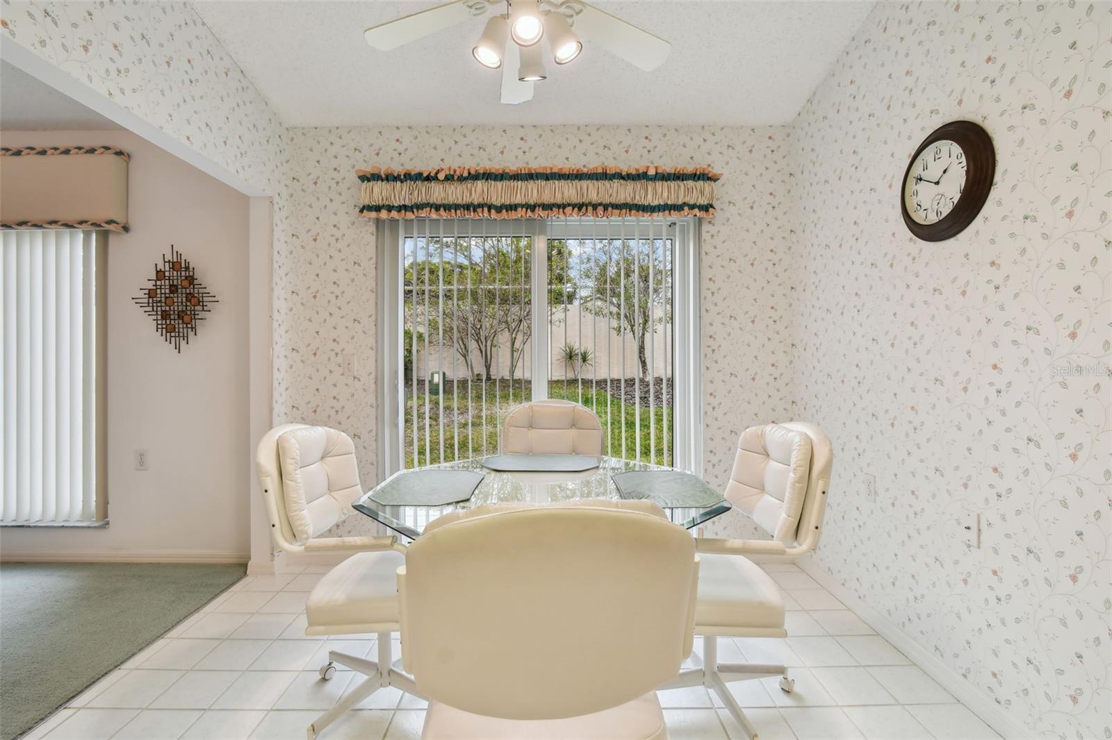 Large dinette area covered in sunshine and hurricane rated sliders 2018.