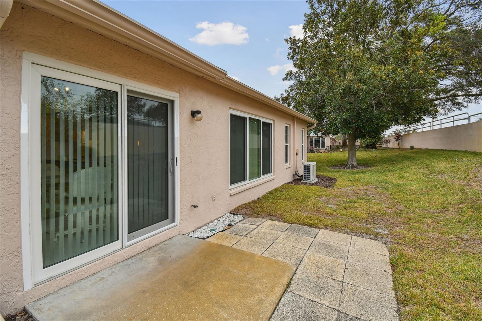 Rear patio to keep our bbq or sit and take in the sunshine with large side yard.