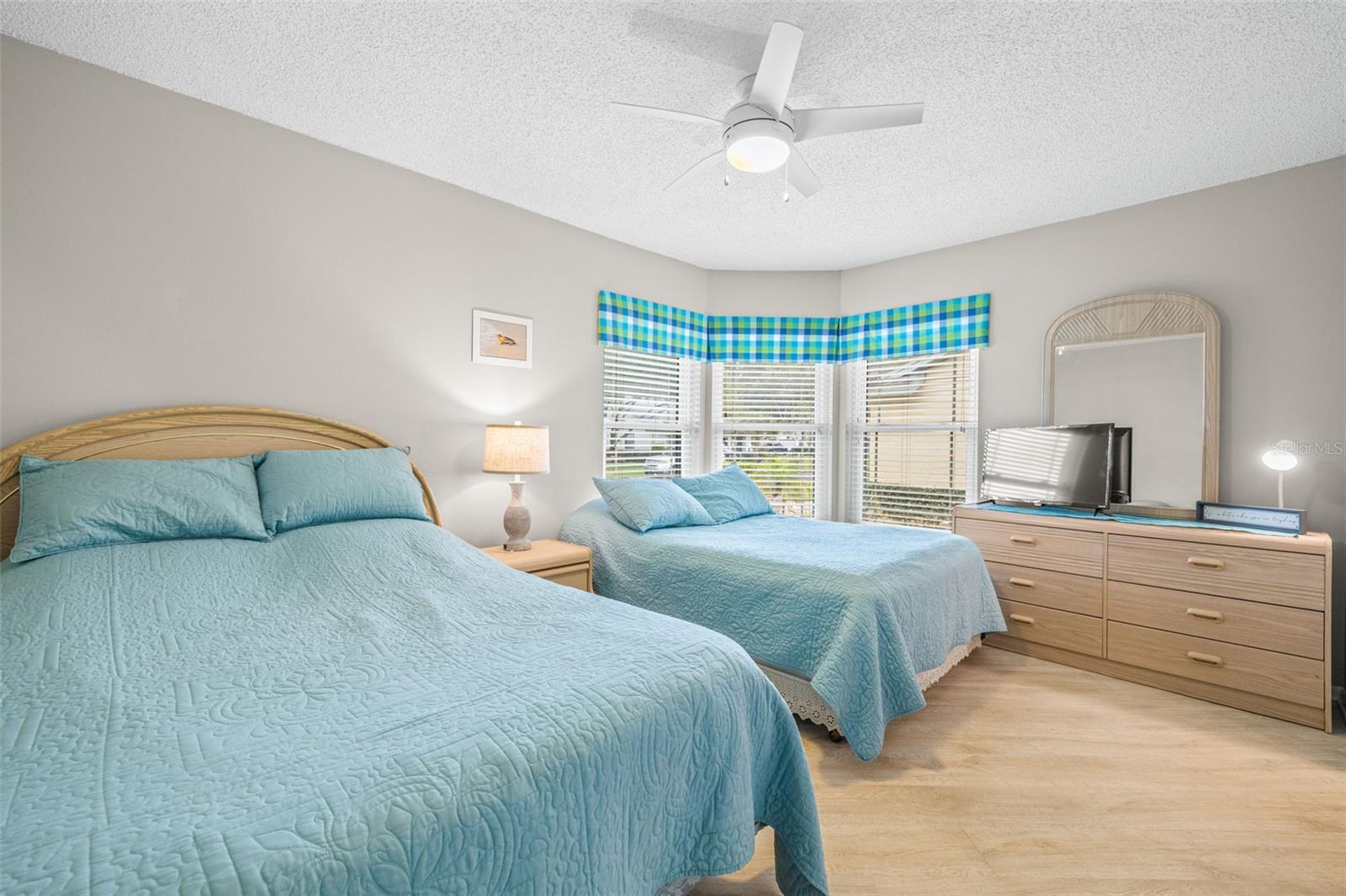 Secondary bedroom, toward the front of the home, easily fits two full sized beds! Perfect for visiting family!