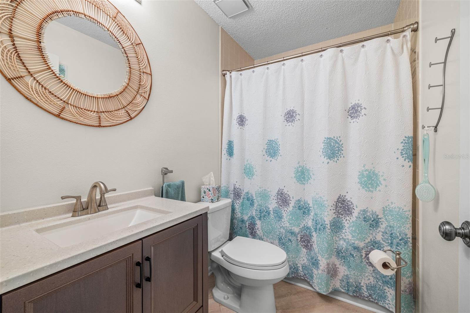 Secondary bathroom has been updated with new flooring, vanity, fixtures, lighting and toilets.