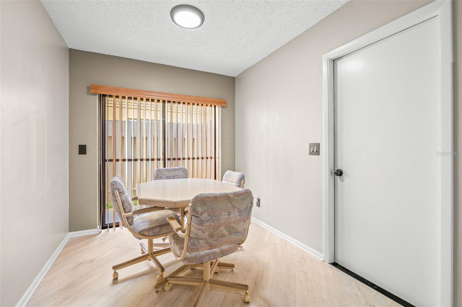 View of eat-in breakfast area. Access to the 2-car garage / laundry and also a sliding glass door to the side patio, a perfect and convenience place for the BBQ!