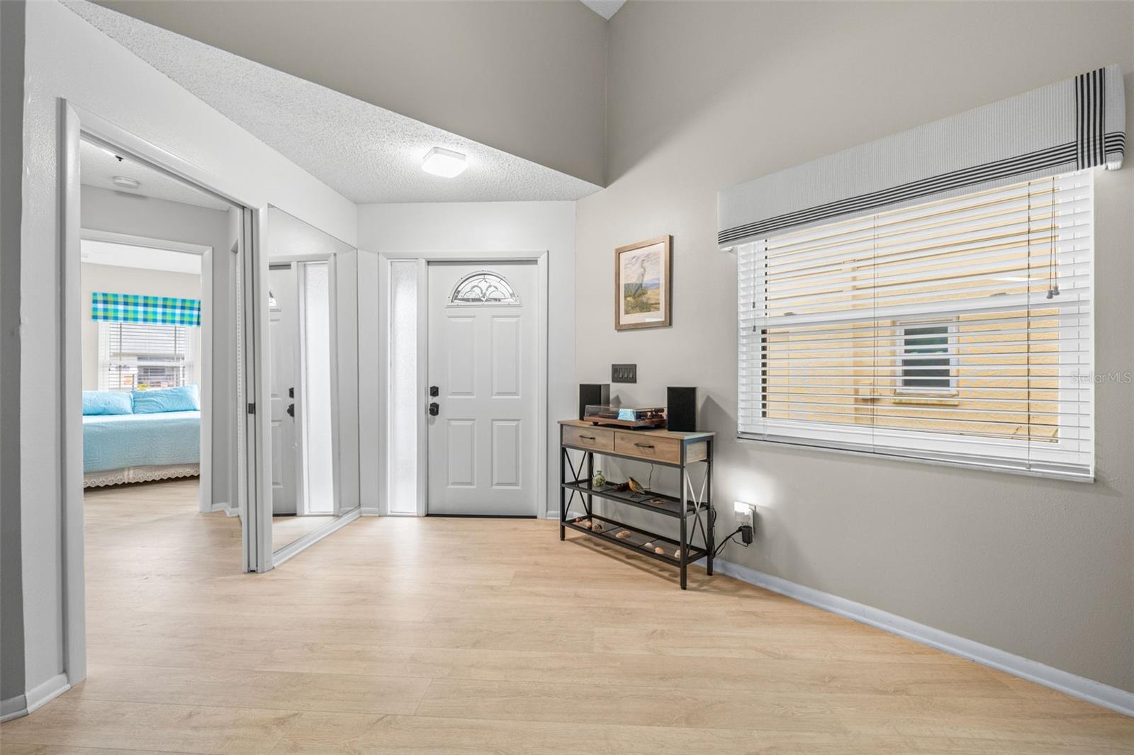 View toward front door! Bright, open floorplan with high ceilings!