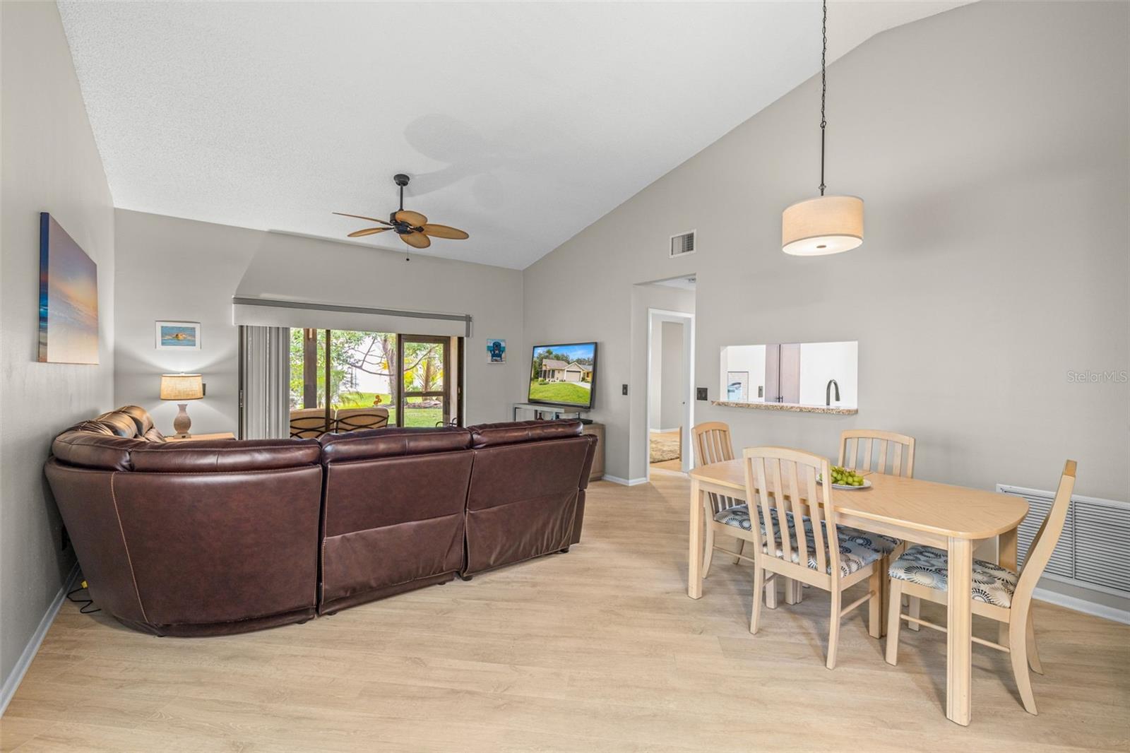 View from front door toward main living area of the home. Notice the high ceilings and bright open floor plan!