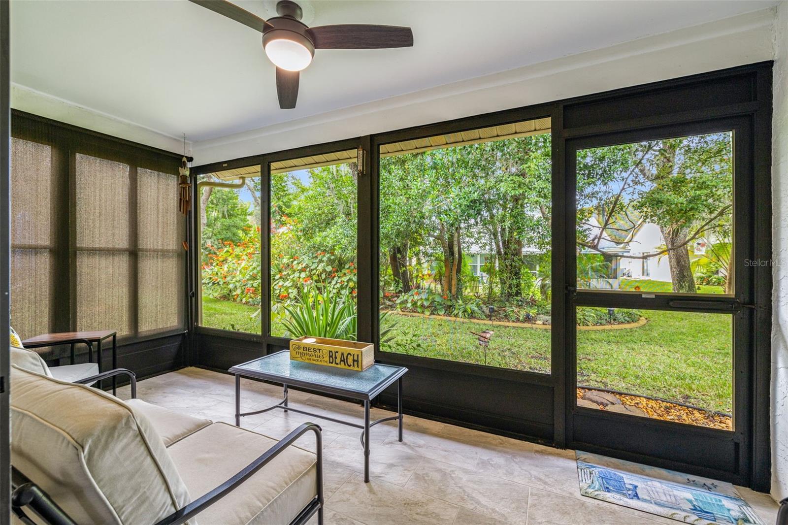 Nestled right off the main living area (and primary bedroom too) this wonderful screened in lanai is perfect for enjoying your morning cup of coffee and watching the wildlife! Notice the ceiling fan for a nice breeze and the newly installed tile flooring for easy cleaning!