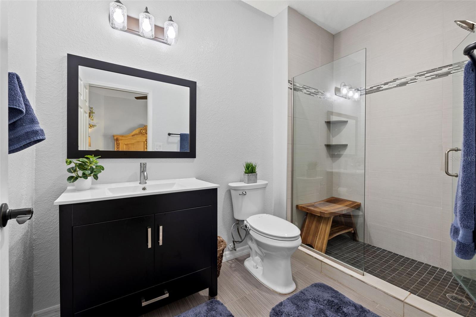 Owner's ensuite bathroom with large walk-in shower.