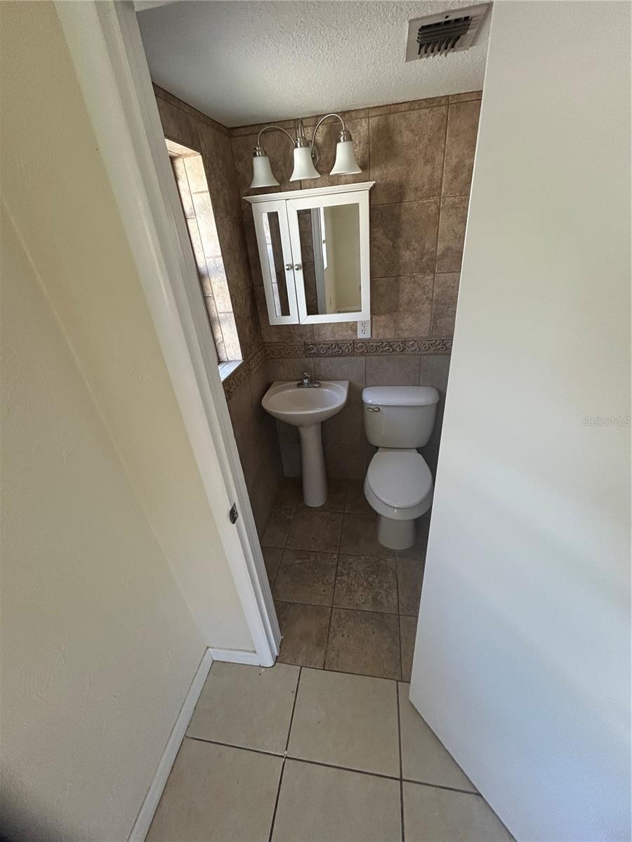 Half bath attached to bedroom 1