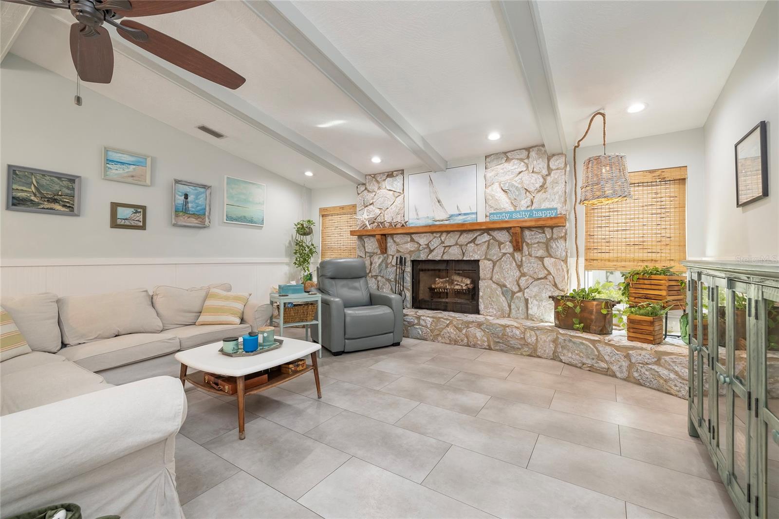 Remodeled family room with stone fireplace