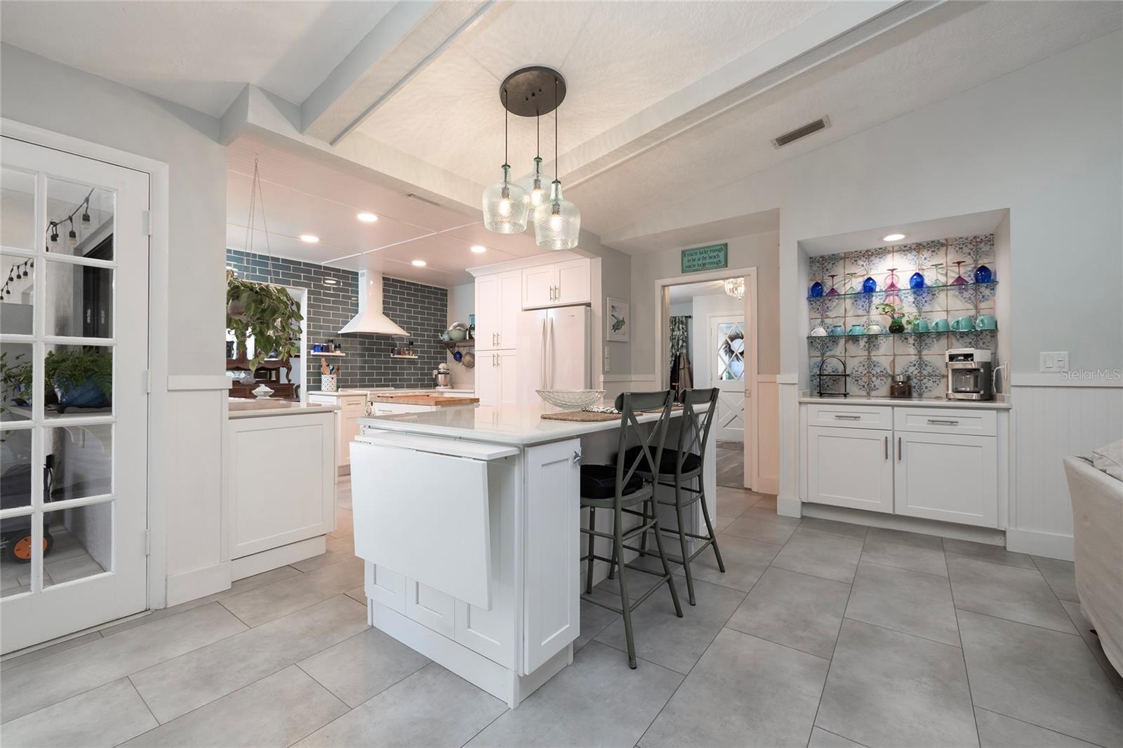 Breakfast Bar with quartz counter expands the space!