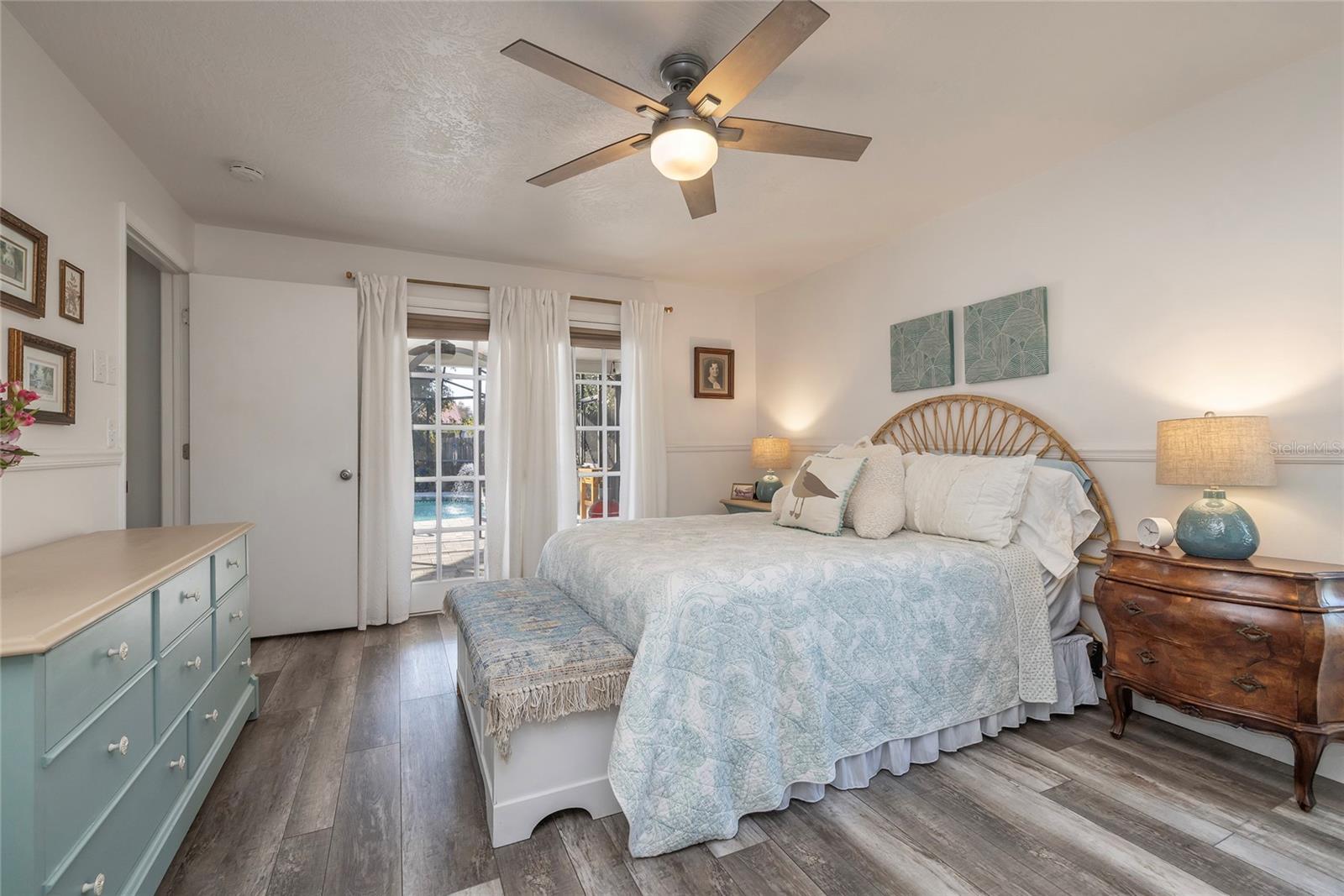 Primary bedroom suite with poolside access