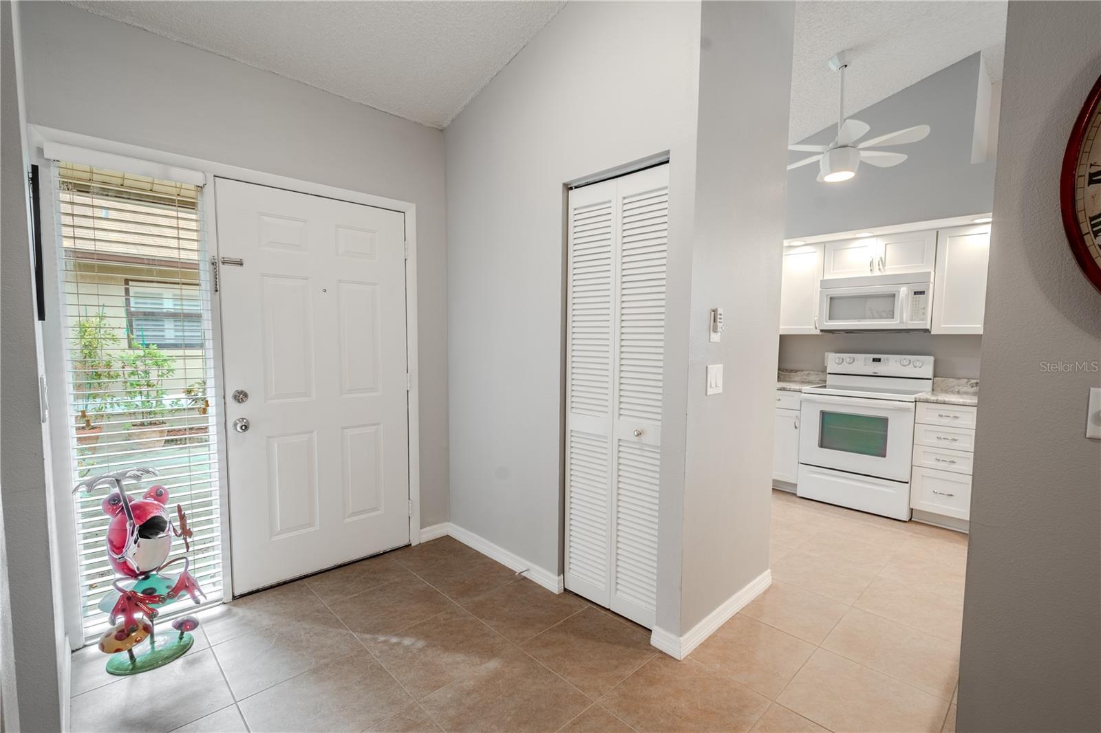 The foyer with coat closet.