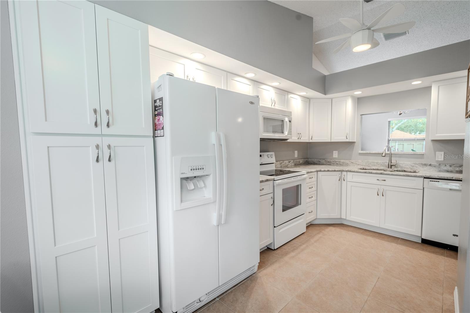 There's plenty of storage in this upgraded kitchen including a closet pantry