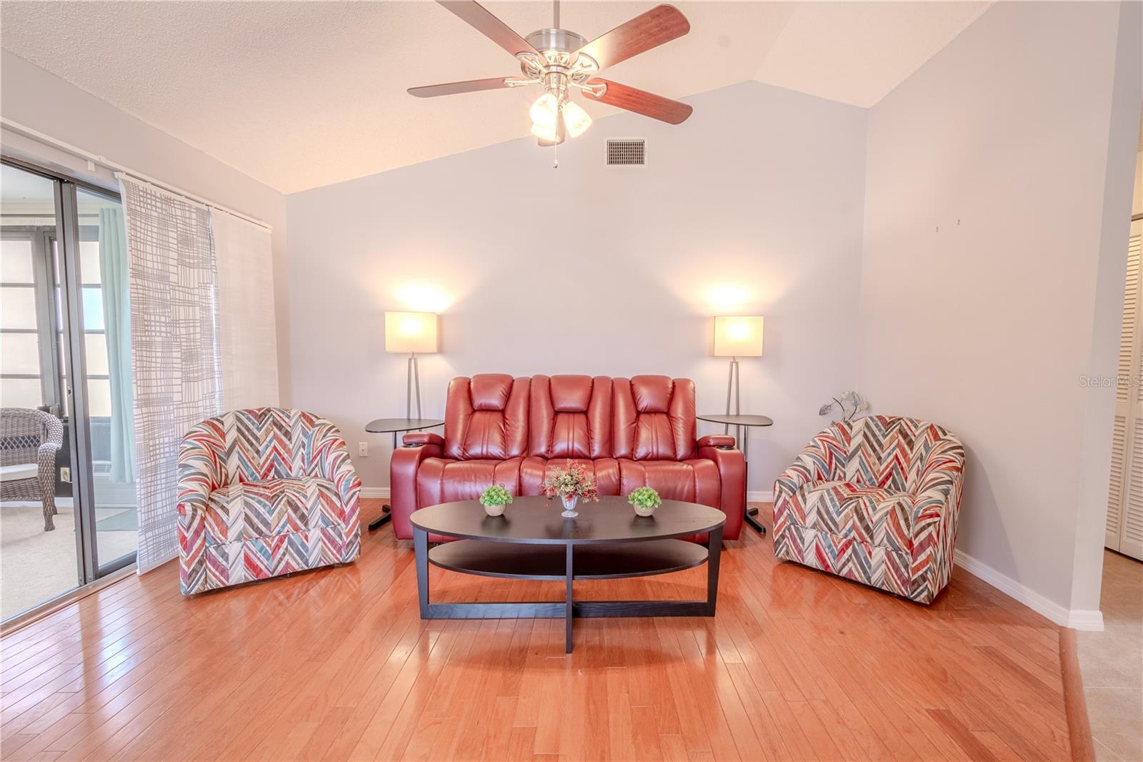 The living room is open and airy, with plenty of natural light.