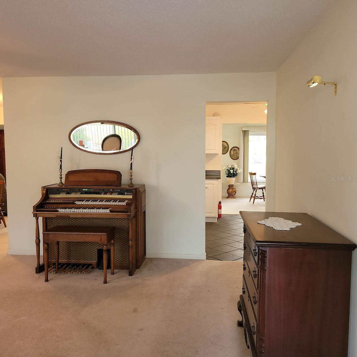 The living room also has a doorway leading to the kitchen and family room.