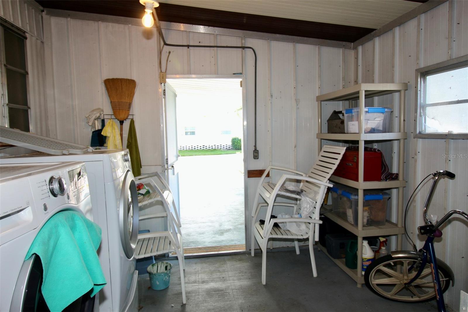 Laundry room door off of Carport.