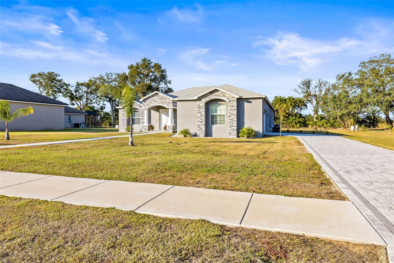 Front view of home & long driveway