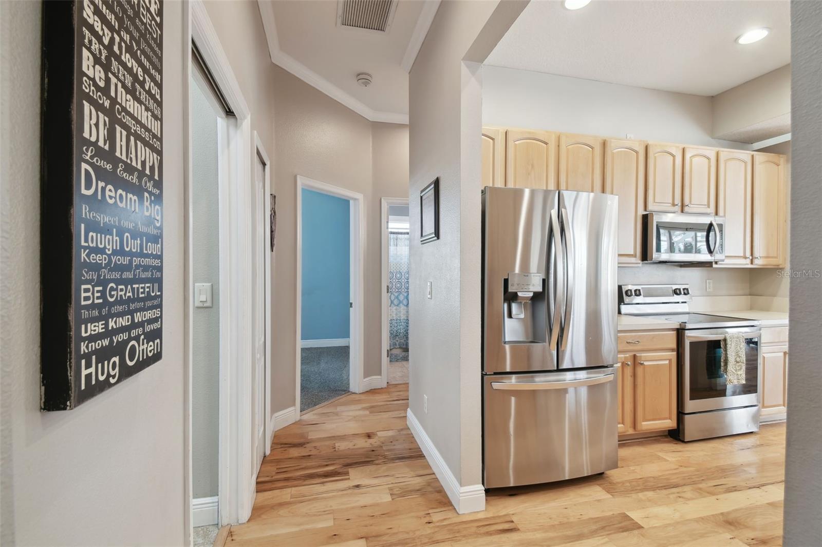 Hallway to utility, 2 bedrooms plus full bath