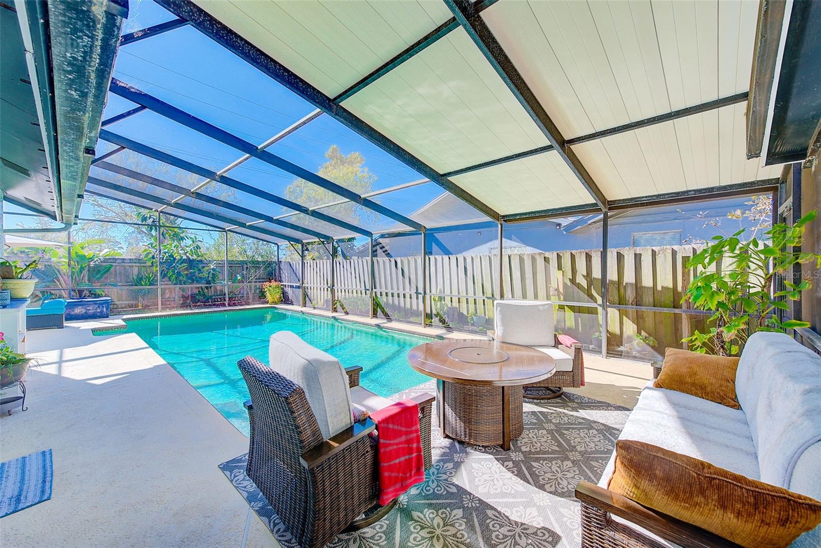 View of inground pool and patio